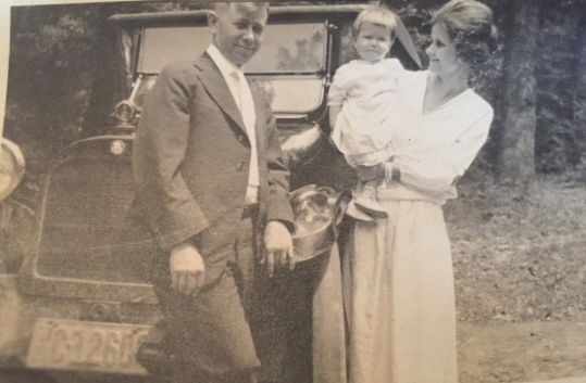 My grandmother, pictured with my grandfather and my mother at about a year old.